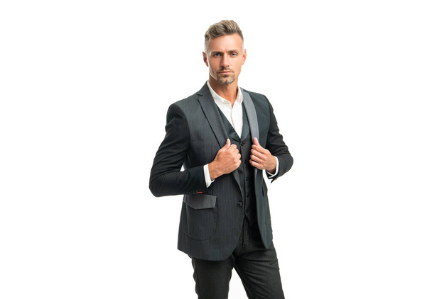 handsome grizzled man butler in formal tuxedo isolated on white. - 写真・画像