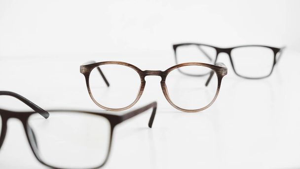 Three optical glasses of different shapes on a white background. - Valokuva, kuva
