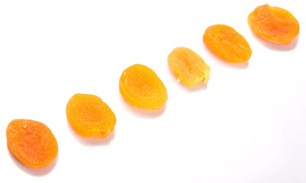 Dried apricot fruit over white background - Photo, Image