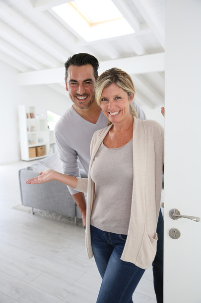 Mature couple standing at home - Foto, immagini