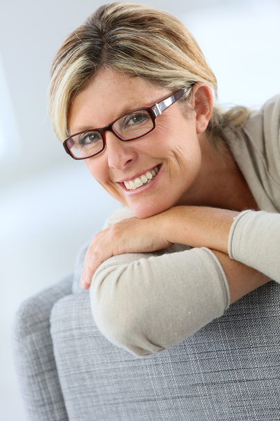 Mature woman wearing eyeglasses - Фото, изображение