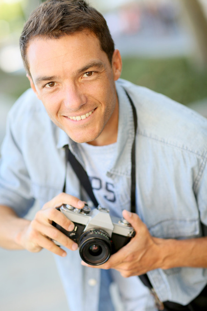 Photographer shooting with old camera - Fotó, kép