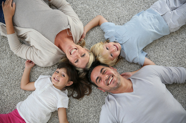 Family of laid on carpet - Photo, image