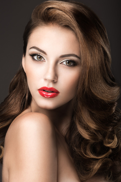 Beautiful woman with evening make-up, red lips and curls. Beauty face. - Fotoğraf, Görsel