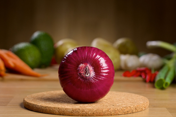Red onion bulb on the wooden background - Foto, Imagem