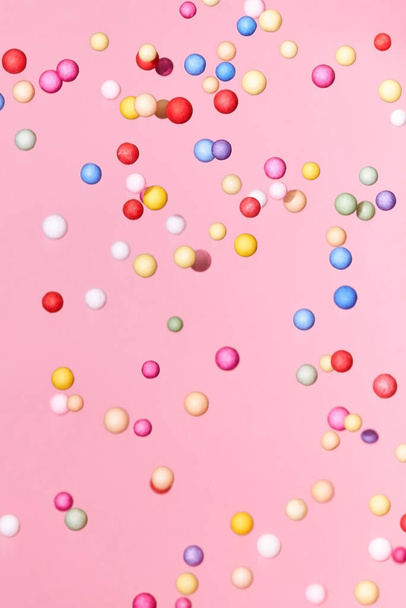 Flying small multicolored polyfoam balls, theme of holidays and birthdays, backdrop. - Fotoğraf, Görsel