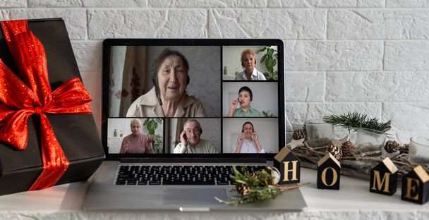 Remote Christmas video party. Family call celebrate New Year 2023 Online video conferencing. Virtual meeting conference calling from home. - 写真・画像