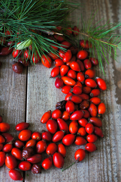 Christmas time table decoration with rose hips - Photo, Image
