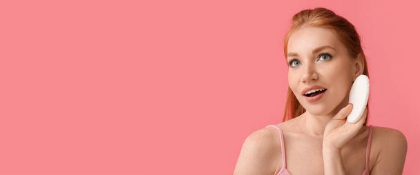 Beautiful woman with makeup sponge on pink background with space for text - Fotografie, Obrázek