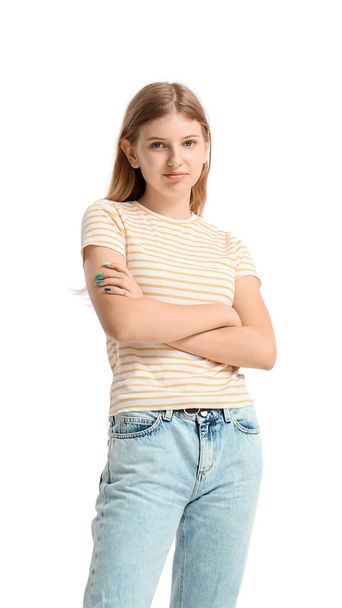 Hübsches Teenager-Mädchen in gestreiftem T-Shirt auf weißem Hintergrund - Foto, Bild
