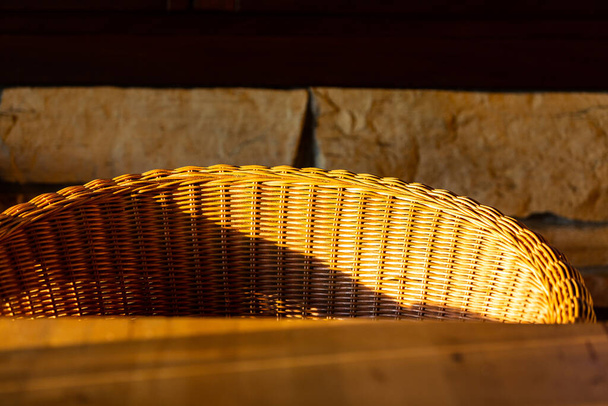 A closeup shot of an empty straw basket - 写真・画像