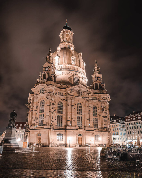 Photo from Dresden old town on a rainy night with the city lights reflecting off the wet ground - Foto, imagen