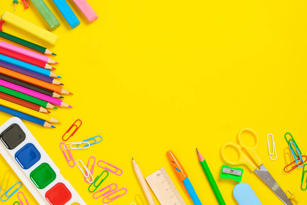 School supplies and stationery yellow background.Preparing child for school - Фото, изображение