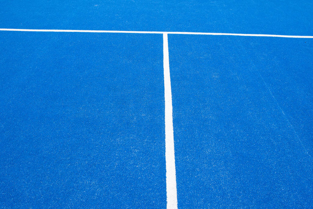 partial view of a blue paddle tennis court with artificial grass - Foto, Imagem