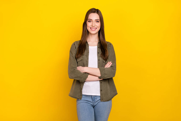 Photo of cheerful good mood intelligent business lady with folded arms posing on camera isolated on yellow color background. - Foto, Imagen