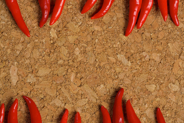 Red hot chilli peppers on a wooden table - Photo, Image