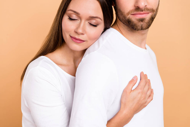 Cropped photo of rest millennial brown hairdo couple hug wear white cloth isolated on beige color background. - Fotoğraf, Görsel
