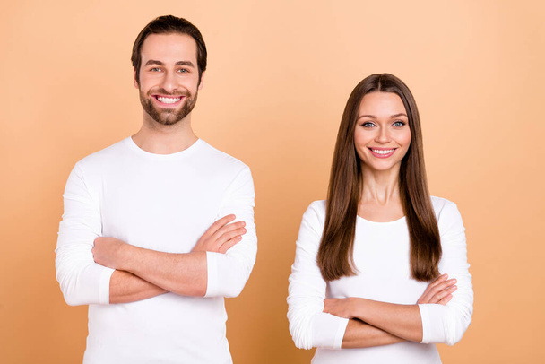 Photo of funky millennial brunette couple crossed arms wear white shirt isolated on beige color background. - 写真・画像
