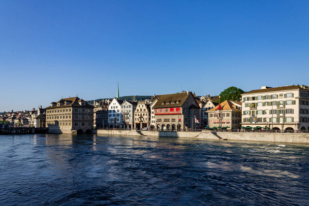 A beautiful view of a Zurich city building next to the Limmat river - Photo, Image