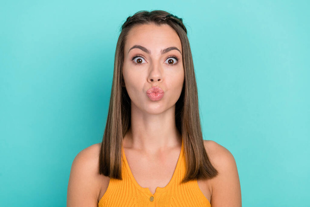 Photo of positive flirty happy young woman funky lady send air kiss good mood isolated on teal color background. - Photo, image