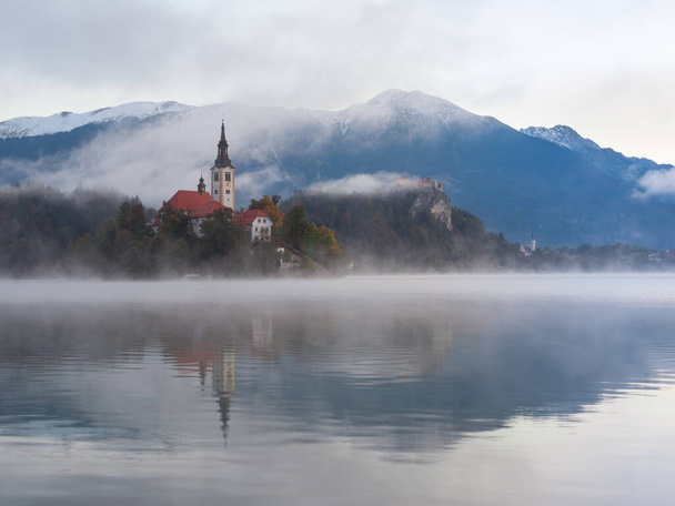A beautiful shot of Bled Island with the church and castle - Photo, Image