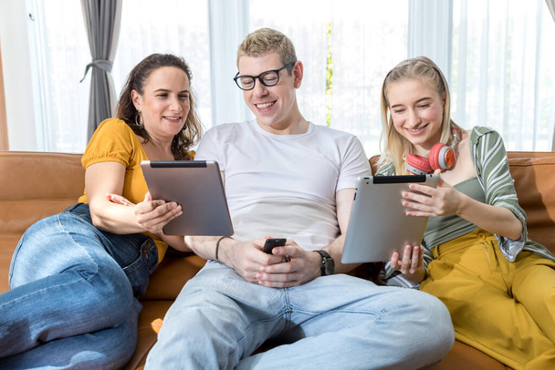 Family smiling in front of camera during live streaming in social network. Family time together at home. Happy Family making online call using Tablet or mobile. - Foto, Imagem