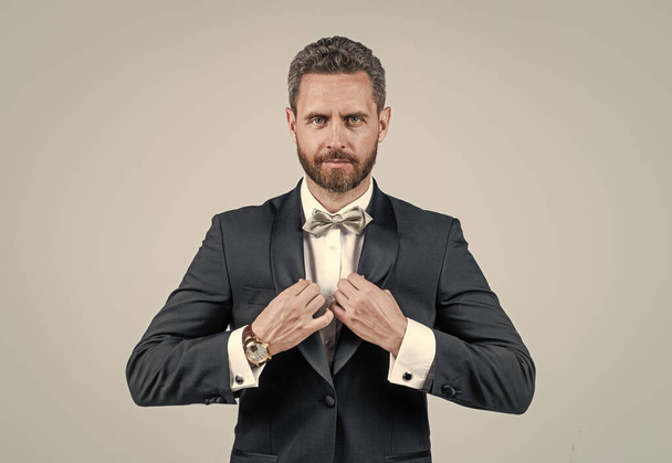 confident and successful businessman in tuxedo bow tie on formal event, tuxedo man. - Φωτογραφία, εικόνα