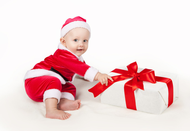 small child dressed as Santa Claus - Фото, изображение