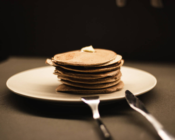 A closeup shot of a pile of protein pancakes on white plate - Photo, image