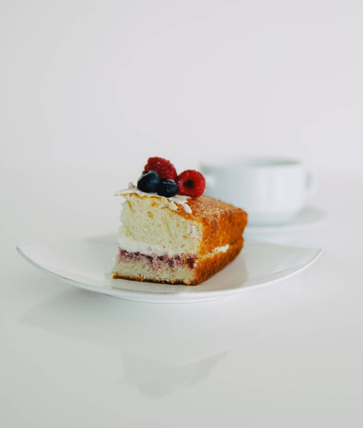 A beautiful shot of a piece of tasty pie with berries on top - Φωτογραφία, εικόνα
