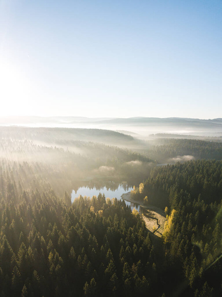 Aerial shot of a lake at sunrise in Saxony - Photo, image