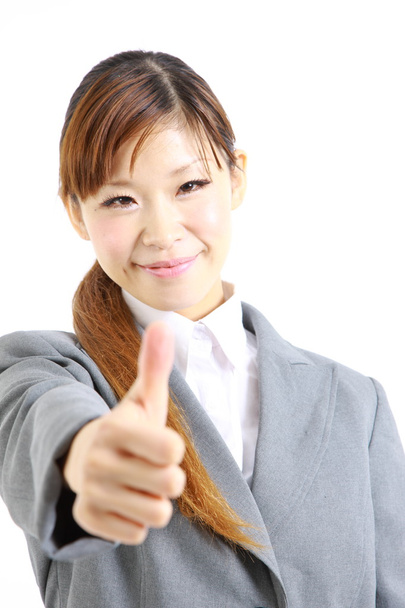 Japanese businesswoman with thumbs up gesture - Photo, image