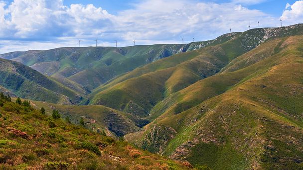 A scenic shot of high mountains and hills covered with green grass meadows in Arouca, Portugal - 写真・画像