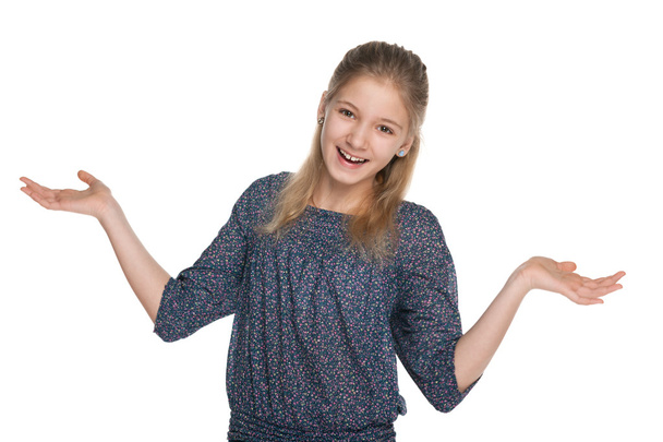 Cheerful preteen girl against the white - Foto, afbeelding