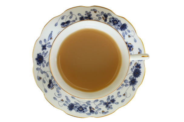 Чай з молоком в старовинній чашці
 - Фото, зображення