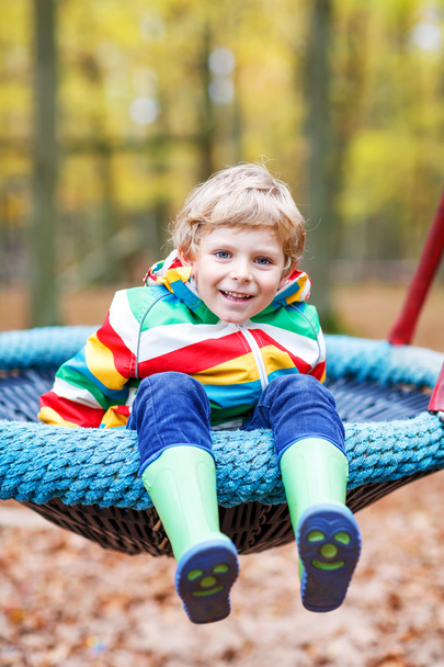 Little kid boy having fun on autumn playground - Photo, Image