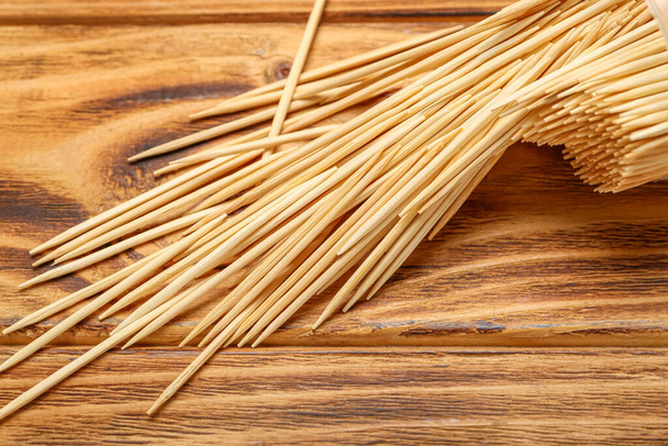 Many toothpicks on wooden background, closeup - Photo, Image