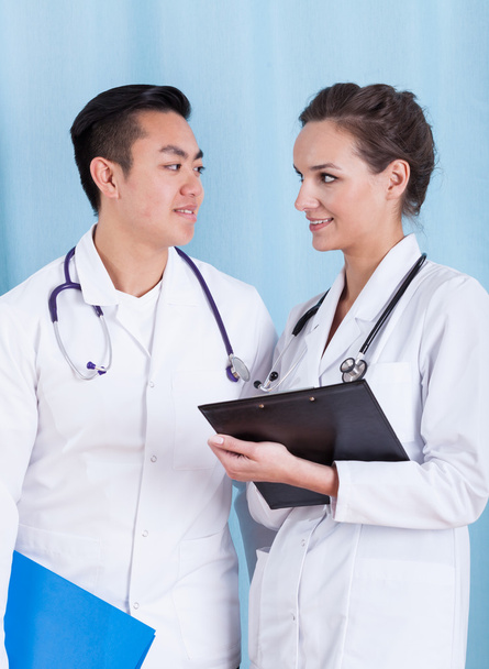 Professional doctors talking at work - Foto, imagen