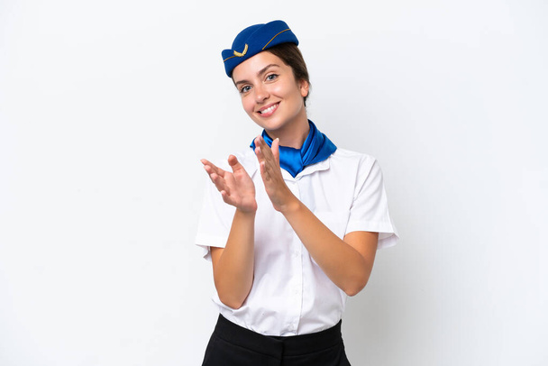 Airplane stewardess caucasian woman isolated on white background applauding after presentation in a conference - Photo, Image