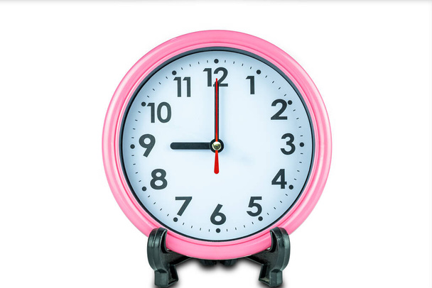 Beautiful pink clock show time of nine o'clock isolated on white background with clipping path. - Photo, image