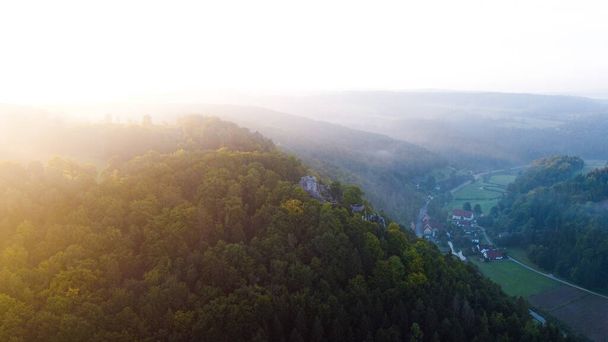 An evergreen mountains during a beautiful sunrise - Fotografie, Obrázek