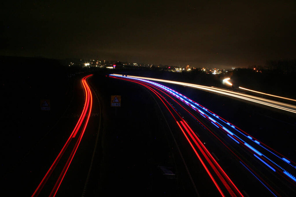A beautiful dark view of a traffic road with long exposure lights - Photo, image
