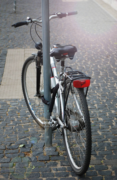 Retro styled bicycle parked in the street. - Photo, Image