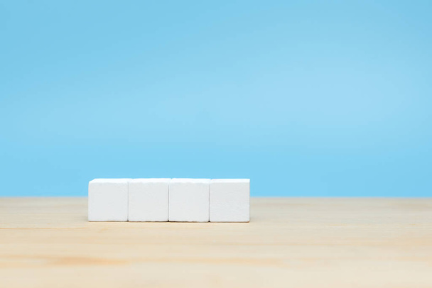 White wooden cube on table with copy space for text or icon - Zdjęcie, obraz