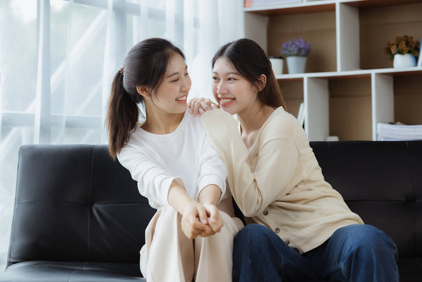 Two beautiful Asian women in a homosexual relationship, queer, gay couple, advocating sexual independence and pride in LGBTQ. Lgbt and love relationship. Supporters of the LGBT community. - Photo, Image