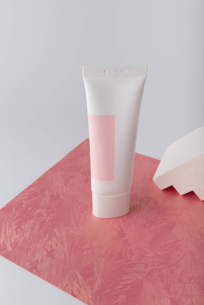 White cosmetics cream tube on pink background template, mock up, no brand. Face skin anti aging care. Concrete decor. Copy space. - Fotoğraf, Görsel