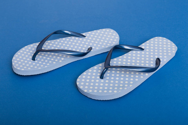 Beach accessories. Flip flops and starfish on colored background. Top view Mock up with copy space. - Φωτογραφία, εικόνα