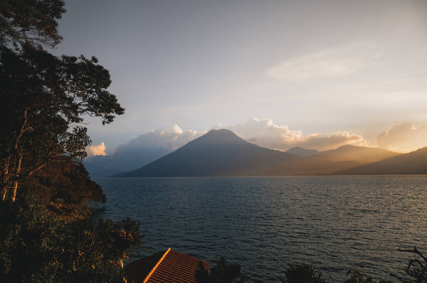A beautiful view of a Lake Atitlan in Guatemala at sunset - Foto, Imagem
