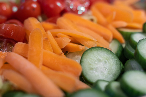 A salad bowl full of fine chopped fresh vegetables - Photo, Image