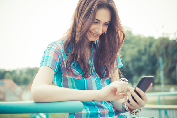 beautiful young hipster woman using smartphone - Foto, Imagem